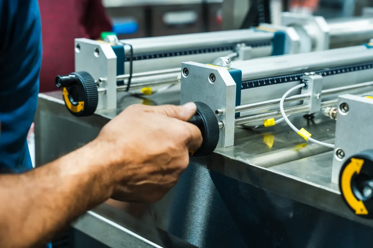 An operator running production equipment at the facility